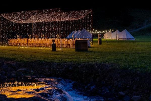 Outdoor event lit up at night at the Selah Valley Estate in the Tweed Valley