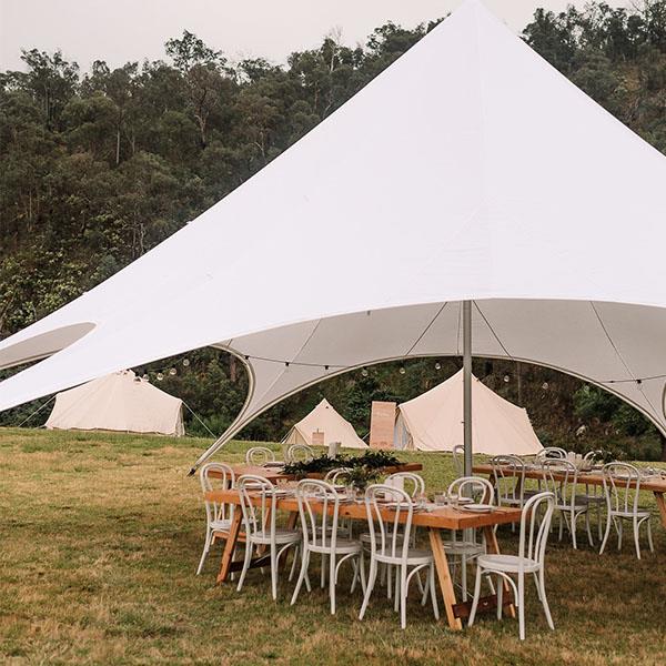Starshade marquee and bell tent village setup ready for outdoor event
